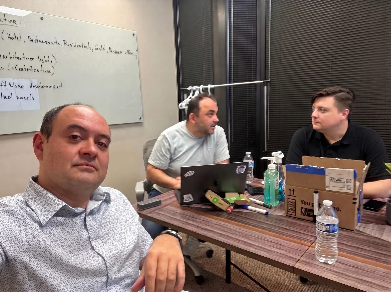 AVgator team members collaborating around the project table